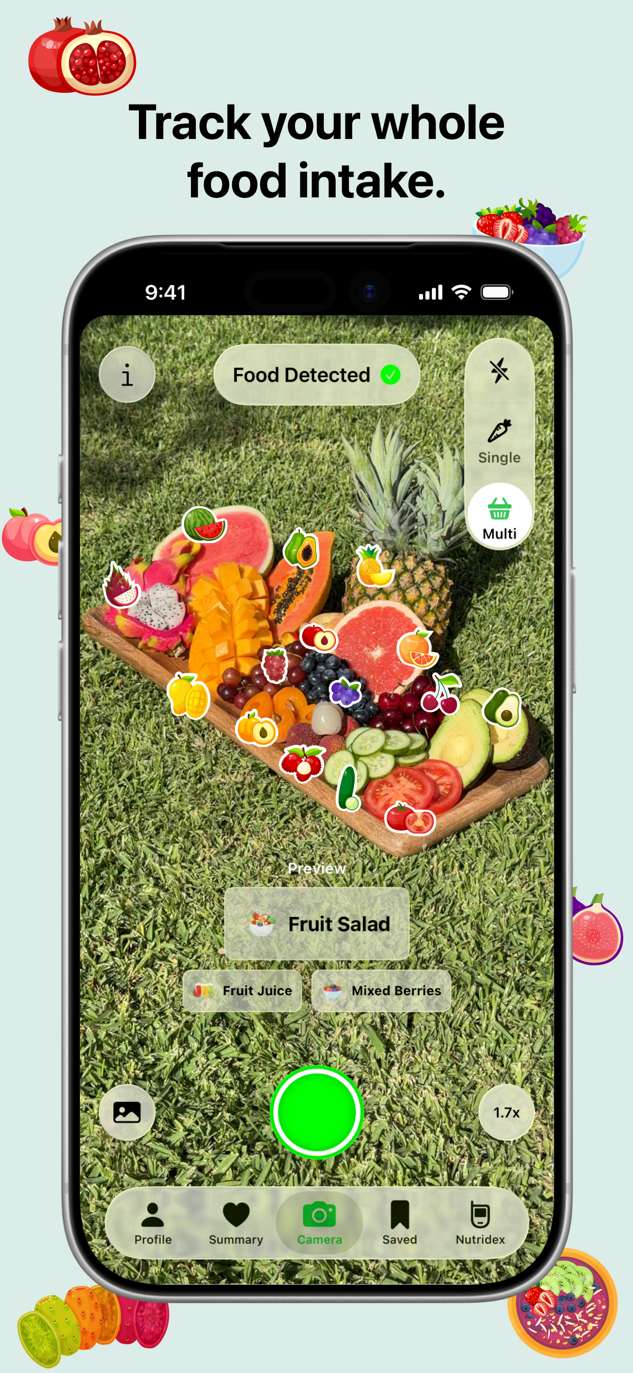 Nutrify app screenshot with the title 'Track your whole food intake.' The camera view shows a colorful fruit salad on a wooden tray on grass, with the app detecting 'Fruit Salad', 'Fruit Juice', and 'Mixed Berries'. A toggle shows Single and Multi mode options. The background is light blue with decorative fruit icons including pomegranate, berries, and passion fruit.