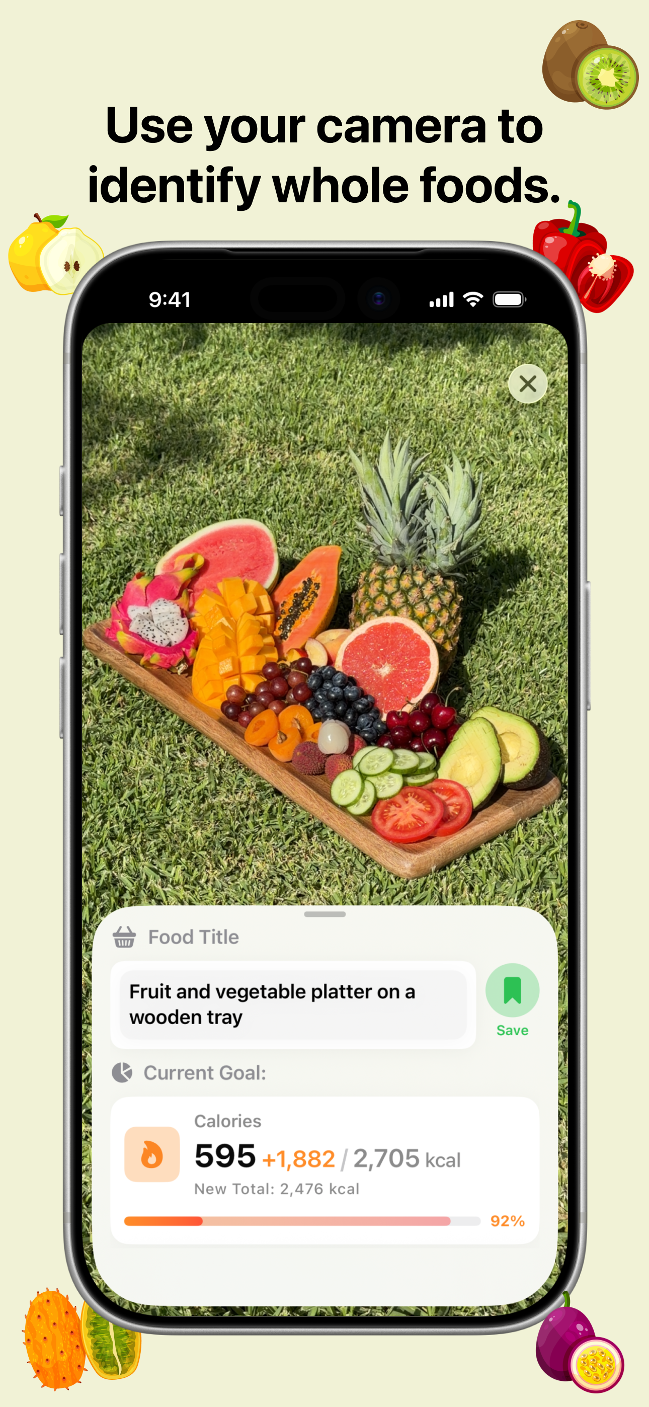 Nutrify app screenshot with the title 'Use your camera to identify whole foods.' A popup displays 'Fruit and vegetable platter on a wooden tray' with calorie tracking showing 595 +1,882 / 2,705 kcal (92%). The background is light green with decorative fruit icons including kiwi, pear, bell peppers, and passion fruit.